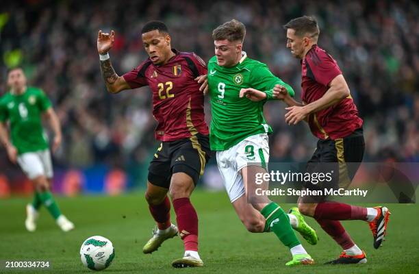 Dublin , Ireland - 23 March 2024; Evan Ferguson of Republic of Ireland in action against Aster Vranckx, left, and Timothy Castagne of Belgium during...