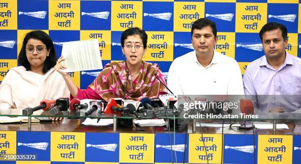 Delhi AAP Government Cabinet Ministers Atishi Singh, with Saurabh Bhardwaj and leader Priyanka Kakkar with Jasmine Shah during a press conference at...