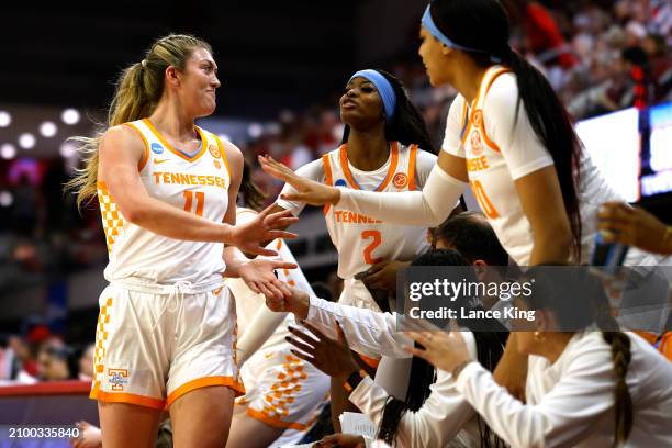 Karoline Striplin of the Tennessee Lady Vols high-fives teammates after fouling out near the end of their game against the Green Bay Phoenix in the...