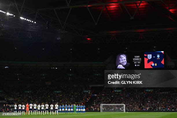 Players observe a minute's applause for former England boss Terry Venables ahead of kick-off in the international friendly football match between...