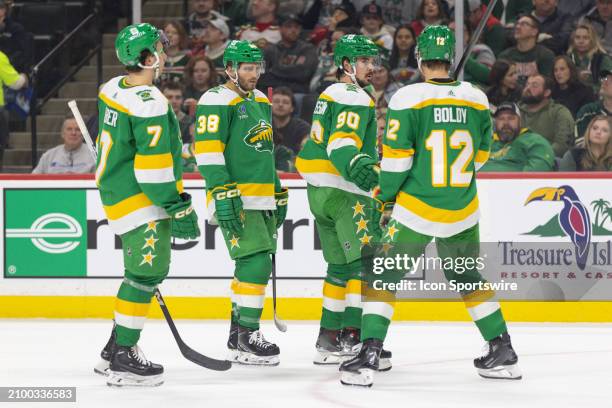 Minnesota Wild huddle up during the first period of an NHL game between the St. Louis Blues and Minnesota Wild on March 23 at the Xcel Energy Center...