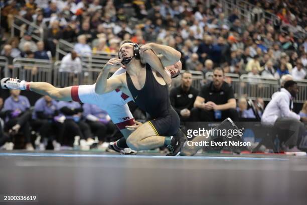 Peyton Robb of the University of Nebraska Cornhuskers competes against Peyten Kellar of the Ohio University Bobcats in the 157-pound class during the...