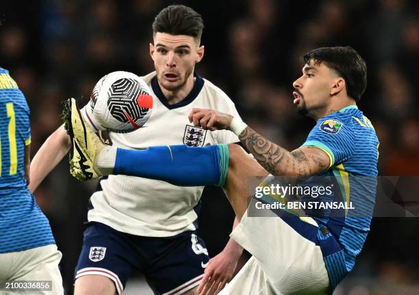 Brazil's midfielder Lucas Paqueta vies with England's midfielder Declan Rice during the international friendly football match between England and...