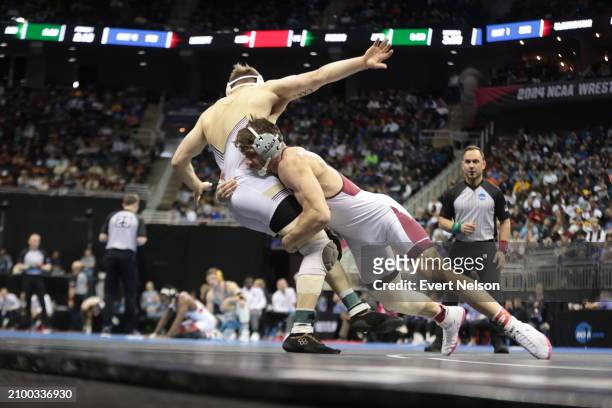 Stephen Little of the Little Rock University Trojans competes against Michael Beard of the Lehigh University Mountain Hawks in the 197-pound class...