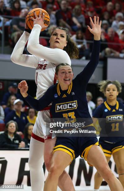 River Baldwin of the North Carolina State Wolfpack controls the ball over Karsen Murphy of the Chattanooga Lady Mocs during the first round of the...