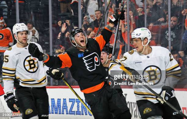 Tyson Foerster of the Philadelphia Flyers reacts after scoring a third period goal against Brandon Carlo and Hampus Lindholm the Boston Bruins at the...