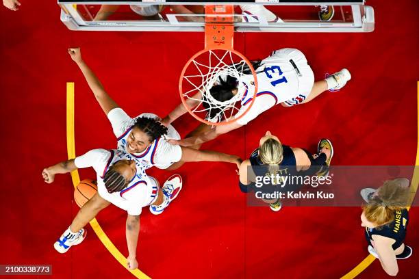 Zakiyah Franklin of the Kansas Jayhawks celebrates with Taiyanna Jackson of the Kansas Jayhawks during the first round of the 2024 NCAA Women's...