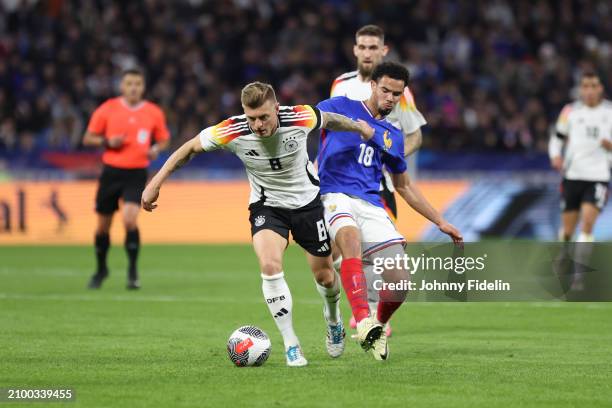 Warren ZAIRE-EMERY of France and Toni Kroos of Germany during the International friendly match between France and Germany at Groupama Stadium on...