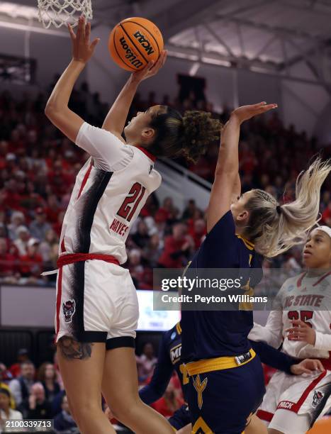 Madison Hayes of the North Carolina State Wolfpack controls the ball against Addie Porter of the Chattanooga Lady Mocs during the first round of the...