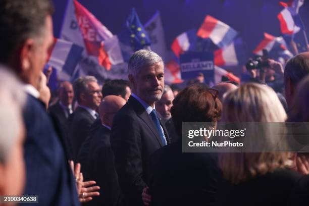 Laurent Wauquiez, a member of the French right-wing party Les Republicains , is listening to speeches during the party's campaign launch rally ahead...
