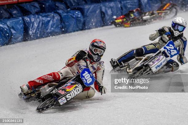 Austria's Franz Zorn in red is leading Finland's Max Koivula while Netherlands' Jasper Iwema is falling behind them during the FIM Ice Speedway...