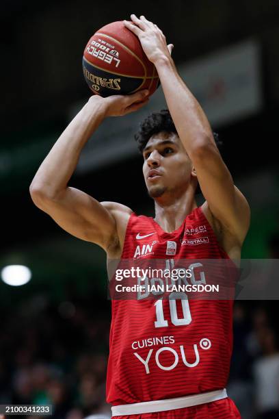 Bourg-en-Bresse's French forward Zaccharie Risacher prepares to shoot the ball during the French Ligue Nationale de Basket Pro A match between...