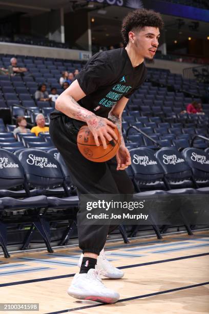 LaMelo Ball of the Charlotte Hornets warms up before the game against the Memphis Grizzlies on March 13, 2024 at FedExForum in Memphis, Tennessee....