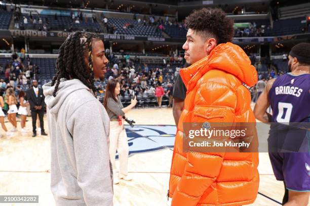 Ja Morant of the Memphis Grizzlies talks to LaMelo Ball of the Charlotte Hornets after the game on March 13, 2024 at FedExForum in Memphis,...