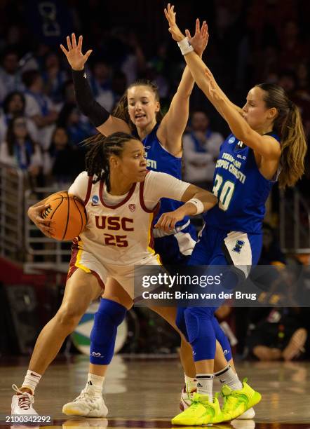 Los Angeles, CA USC McKenzie Forbes, no. 25 battles under the basket with and Texas A&M Corpus Christi's Annukka Willstedt, no. 30 as the seed USC...