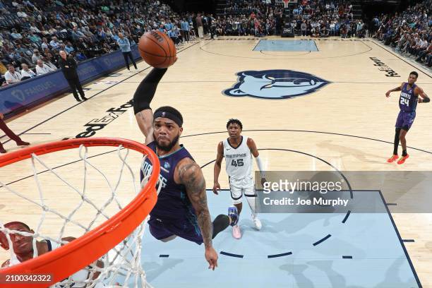 Miles Bridges of the Charlotte Hornets dunks the ball during the game against the Memphis Grizzlies on March 13, 2024 at FedExForum in Memphis,...