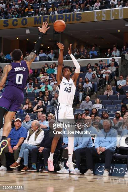 Jackson of the Memphis Grizzlies shoots a three point basket against the Charlotte Hornets on March 13, 2024 at FedExForum in Memphis, Tennessee....