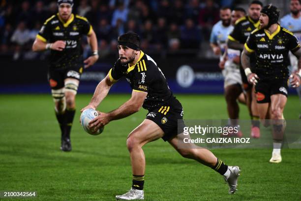 La Rochelle's French centre Jules Favre passes the ball during the French Top14 rugby union match between Aviron Bayonnais and Stade Rochelais at...