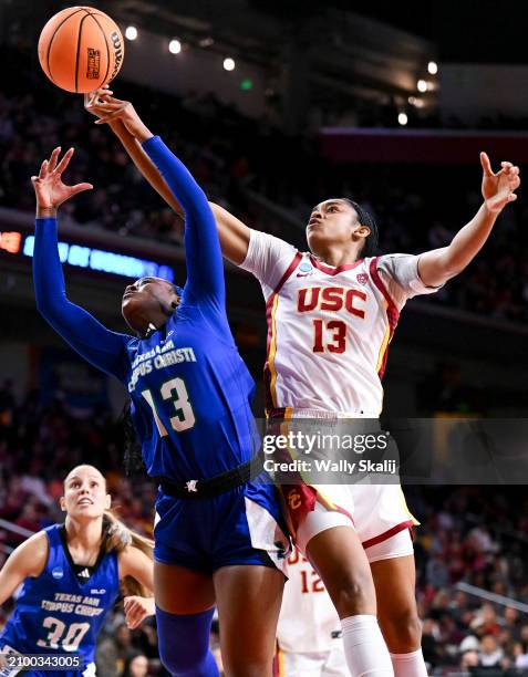Alecia Westbrook of the Texas A&M Corpus Christi Islanders and Rayah Marshall of the USC Trojans battle for the rebound during the first round of the...