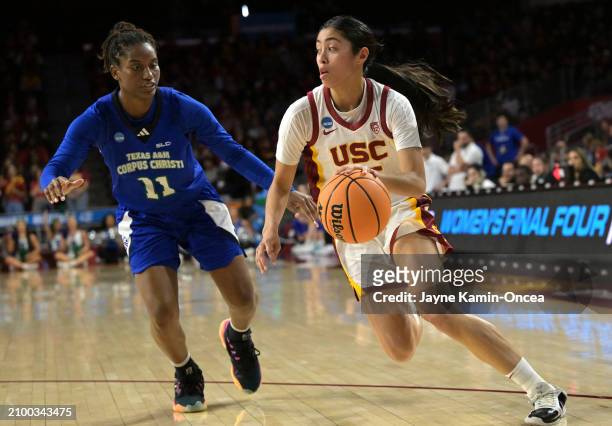 Kayla Padilla of the USC Trojans drives past Paige Allen of the Texas A&M-CC Islanders in the second half of the NCAA Women's Basketball Tournament...
