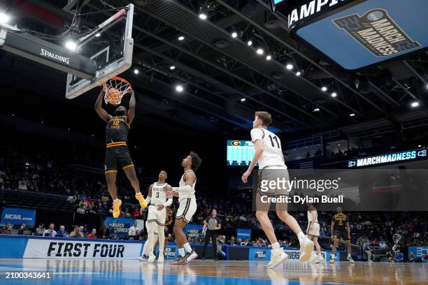 Jonathan Aku of the Grambling State Tigers dunks the ball against the Montana State Bobcats during the first half in the First Four game of the NCAA...