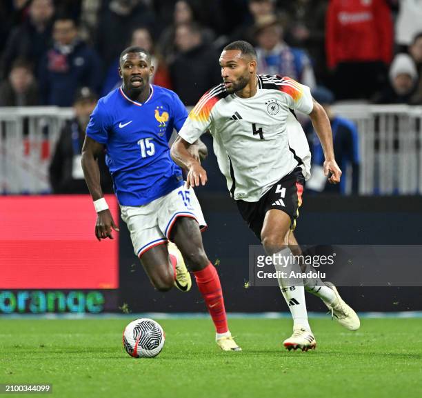 Jonathan Tah of Germany in action during the international friendly football match between France and Germany at Groupama Stadium in...