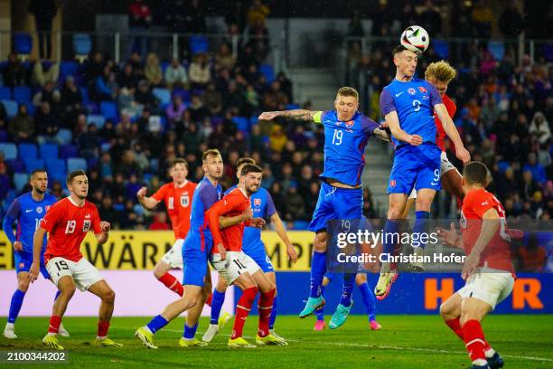 Robert Bozenik of Slovakia goes for a header during the international friendly match between Slovakia and Austria at National Football stadium on...