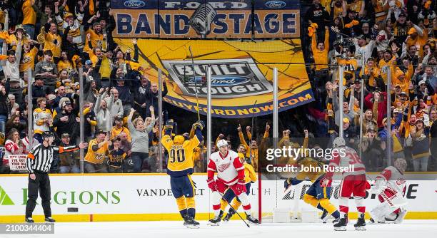 Filip Forsberg celebrates his goal with Ryan O'Reilly of the Nashville Predators against Alex Lyon of the Detroit Red Wings during an NHL game at...