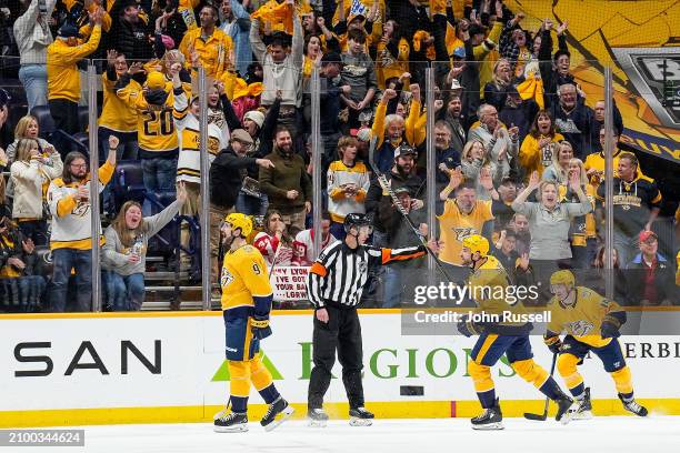 Filip Forsberg celebrates his goal with Ryan O'Reilly and Gustav Nyquist of the Nashville Predators against he Detroit Red Wings during an NHL game...