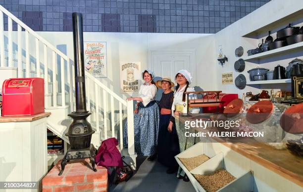 Fans pose for photos in a reproduction of the set of "Oleson's Mercantile" general store during "The Little House on the Prairie" 50th anniversary...