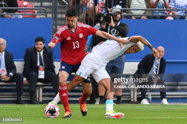 Honduras's defender Andy Najar fights for the ball with Costa Rica's midfielder Jefferson Brenes during the Concacaf Nations League play-off football...