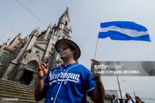 Nicaraguan exiles residing in Costa Rica participate in the "Via Crucis for Nicaragua" at the San Isidro de Coronado Church in San José on March 23,...