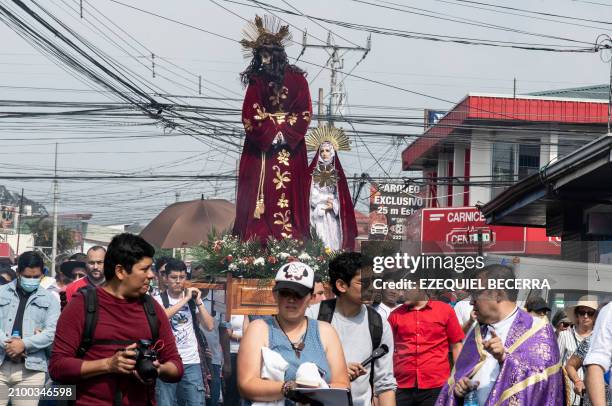 Nicaraguan exiles residing in Costa Rica participate in the "Via Crucis for Nicaragua" at the San Isidro de Coronado Church in San José on March 23,...