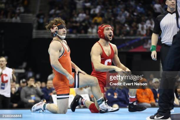 Vito Arujau of the Cornell University Big Red wrestles Daton Fix of the Oklahoma State University Cowboys during the Division I Men's Wrestling...