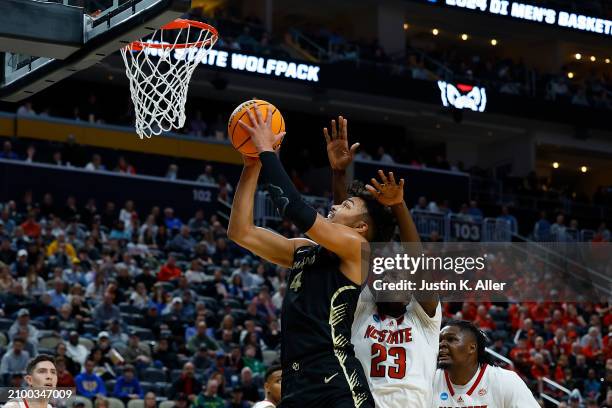 Trey Townsend of the Oakland Golden Grizzlies goes to the basket against Mohamed Diarra of the North Carolina State Wolfpack in the second half...