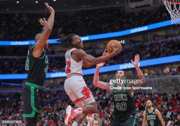 Ayo Dosunmu of the Chicago Bulls drives to the basket for a layup during the second half against the Boston Celtics at the United Center on March 23,...