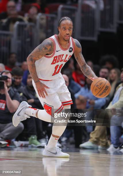 DeMar DeRozan of the Chicago Bulls brings the ball up court during the second half against the Boston Celtics at the United Center on March 23, 2024...