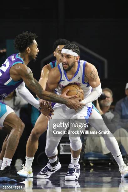 Hunter Maldonado of the Oklahoma City Blue handles the ball during the game against Greensboro Swarm on March 23, 2024 at Greensboro Coliseum in...