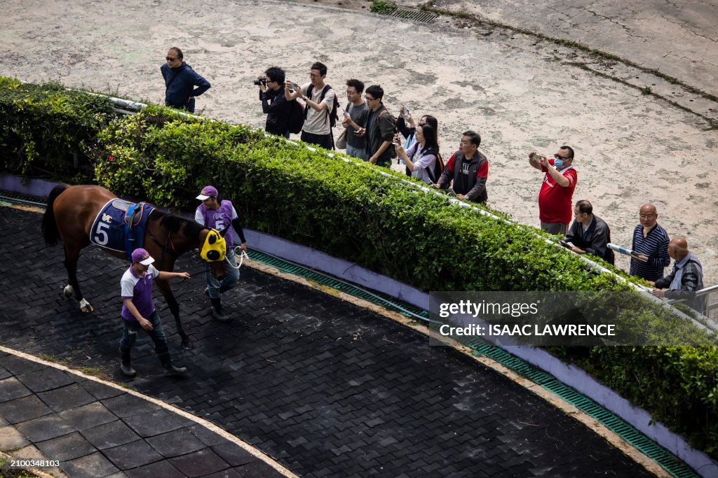 Mic Mac Racing This photo taken on March 17, 2024 shows members of the public... News ...