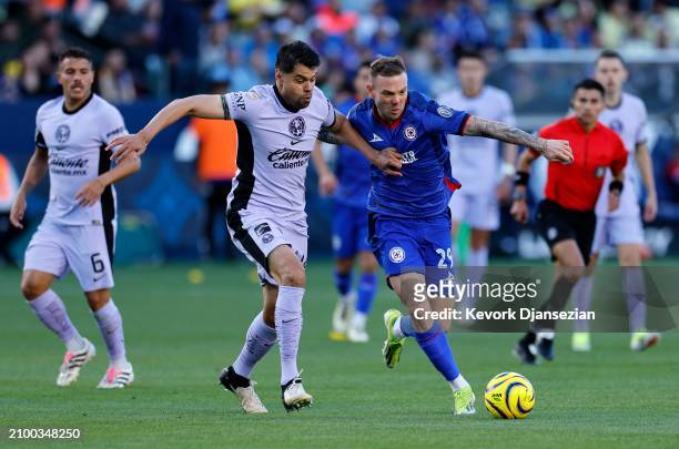 Carlos Rodolfo Rotondi of Cruz Azul and Nestor Araujo battle for the ball during the first half Dignity Health Sports Park on March 23, 2024 in...