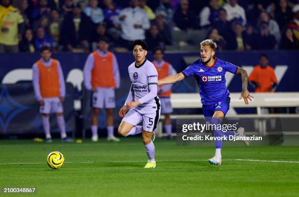 Kevin Alvarez of Club America looks to pass the ball as he defended by Gonzalo Piovi of Cruz Azul during the second half of their club friendly match...