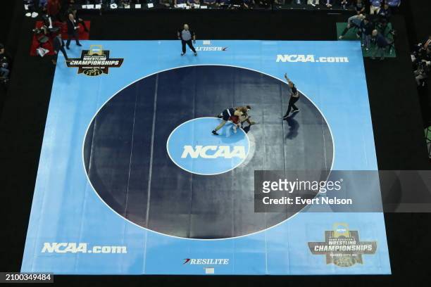 Dustin Plott of the Oklahoma State University Cowboys competes against Parker Keckeisen of the University of Northern Iowa Panthers in the 184-pound...
