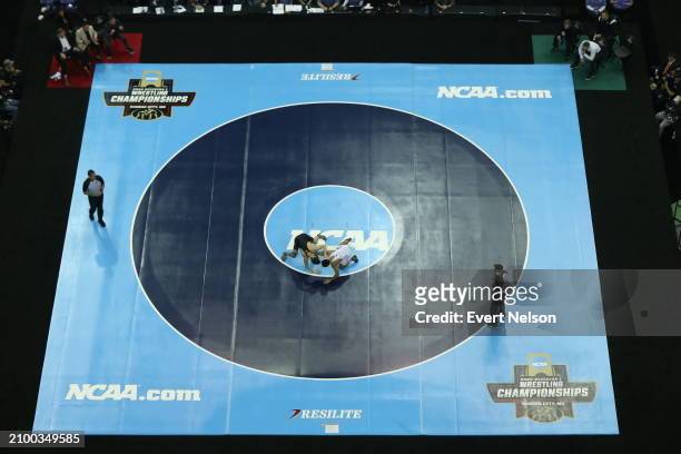 Richard Figueroa of the Arizona State University Sun Devils competes against Drake Ayala of the University of Iowa Hawkeyes in the 125-pound class...