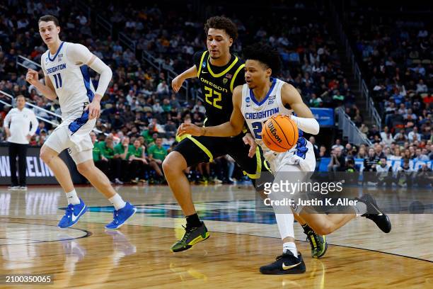 Trey Alexander of the Creighton Bluejays dribbles past Jadrian Tracey of the Oregon Ducks in the second half during the second round of the 2024 NCAA...