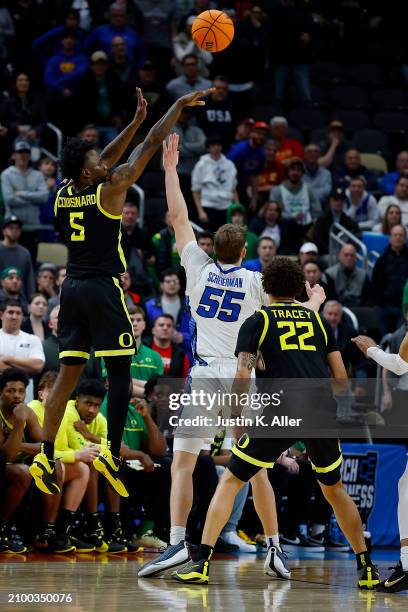 Jermaine Couisnard of the Oregon Ducks puts up a shot over Baylor Scheierman of the Creighton Bluejays in the first overtime during the second round...