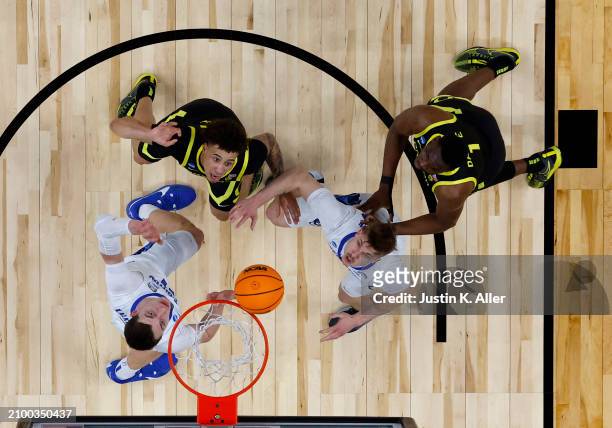 Gabe Reichle of the Oregon Ducks goes for a rebound against Ryan Kalkbrenner of the Creighton Bluejays during the second round of the 2024 NCAA Men's...