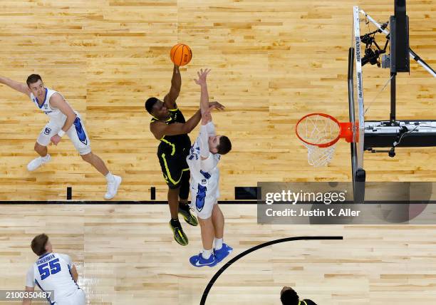 Faly Dante of the Oregon Ducks puts up a shot over Ryan Kalkbrenner of the Creighton Bluejays in the second half during the second round of the 2024...