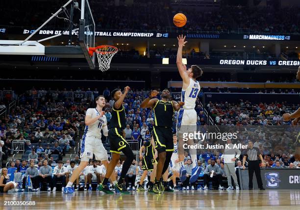 Mason Miller of the Creighton Bluejays goes for a rebound against N'Faly Dante of the Oregon Ducks in the second half during the second round of the...