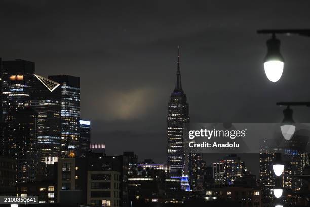 Empire State Building is seen in the dark during Earth Hour, WWF's global initiative, major squares around the world remain dark for one hour to...