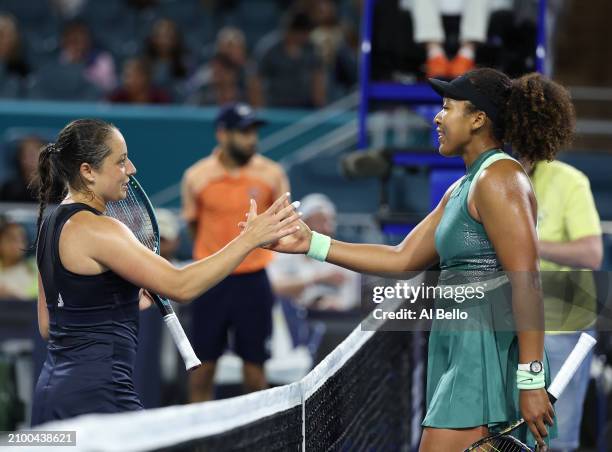 Naomi Osaka of Japan meets Elisabetta Cocciaretto of Italy at the net after defeating her during their match on Day 5 of the Miami Open at Hard Rock...